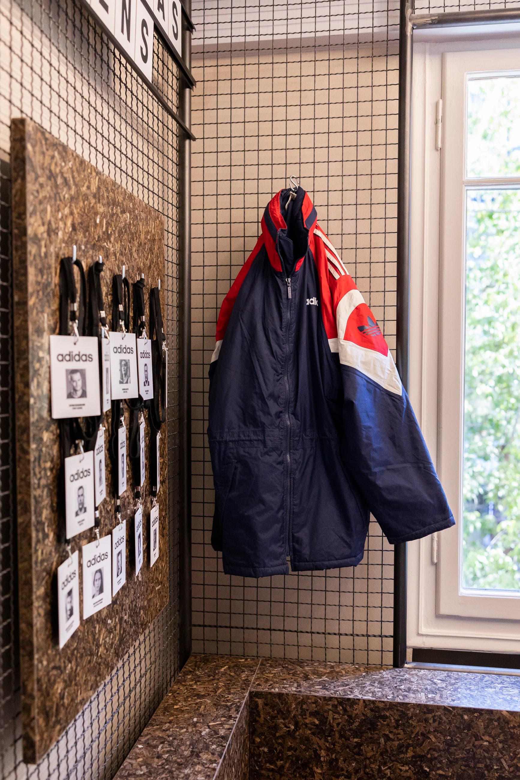 Adidas Athens — PHEE Board noticeboard, hanging jacket, and bench