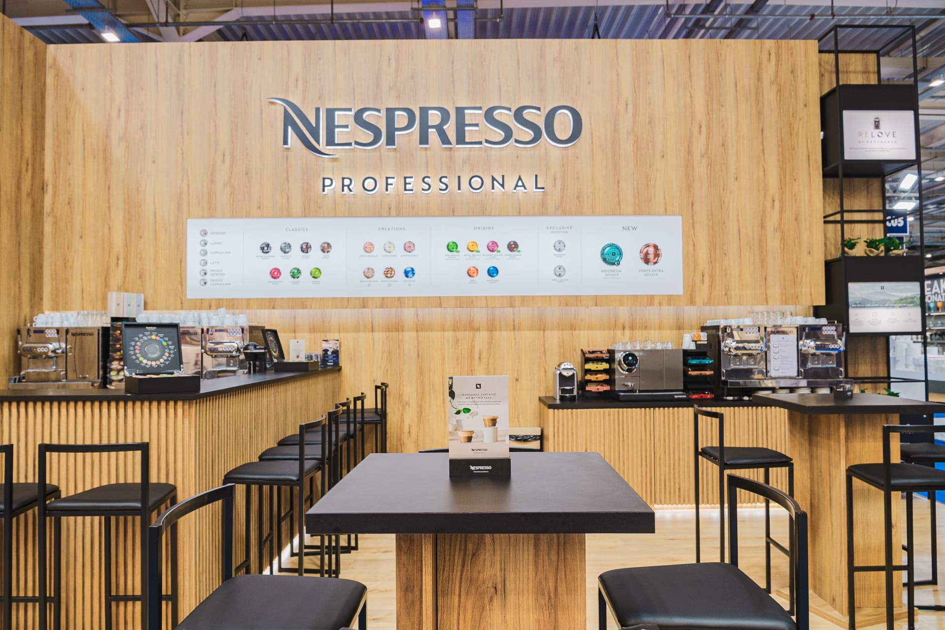 Nespresso Professional kiosk at Xenia 2024 — CoPHEE Board tabletops and counter