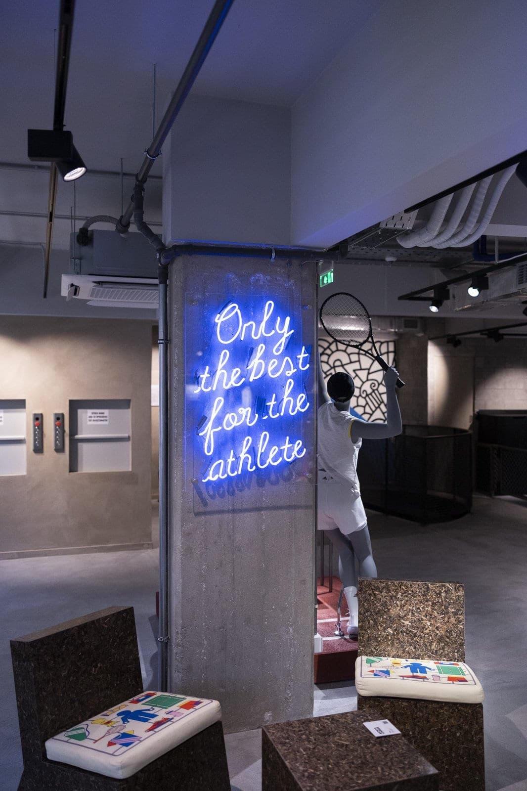 PHEE Board lounge chair under neon signage