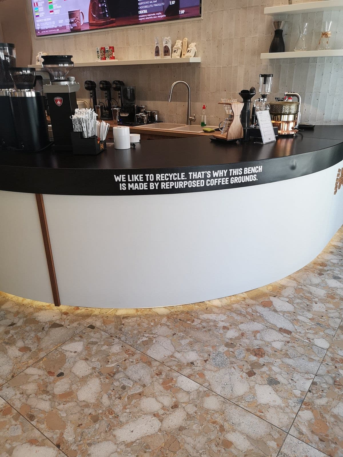 Specialty coffee bar with CoPHEE Board top and recycling signage