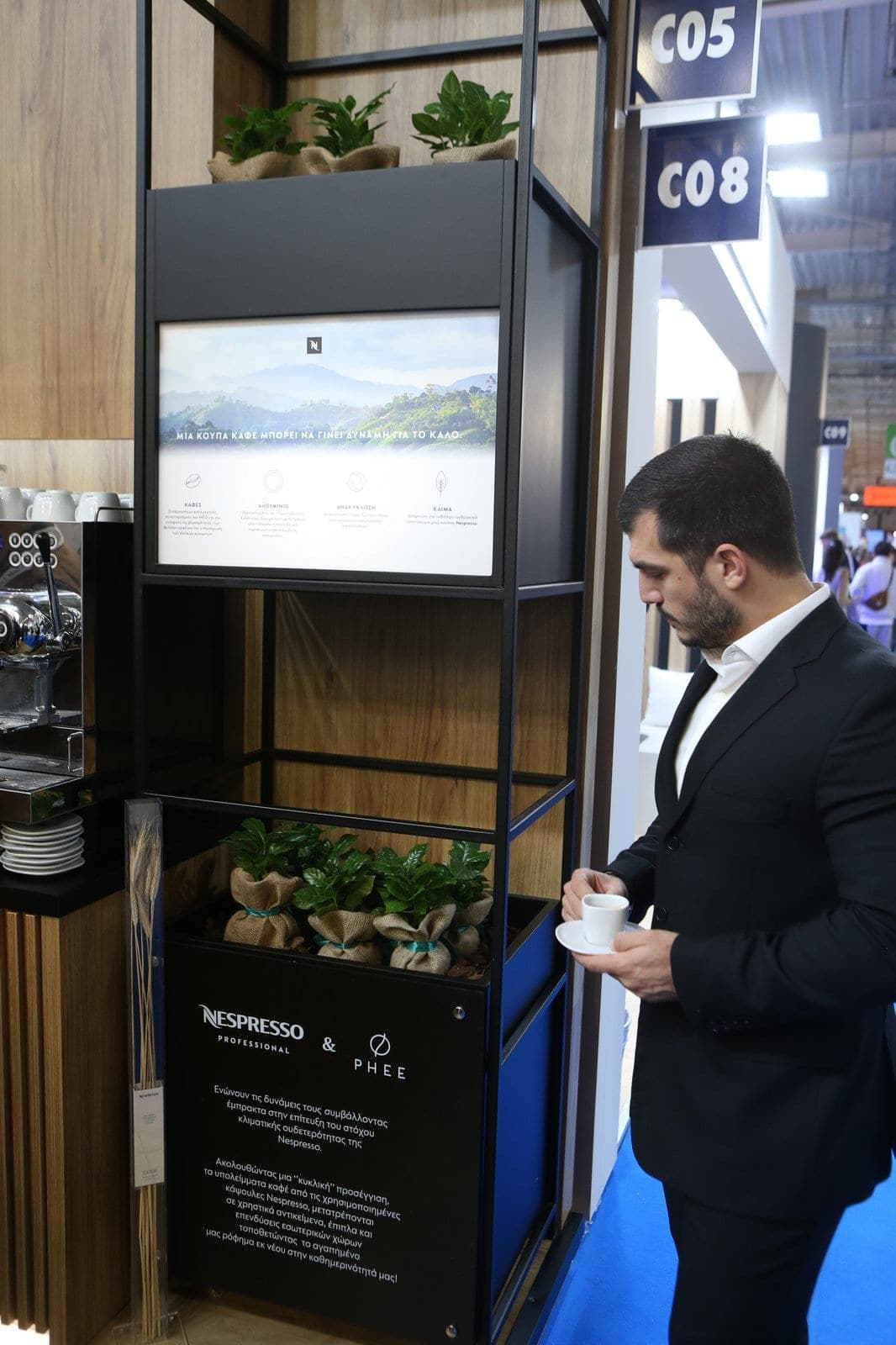 Nespresso Professional × PHEE vertical display with greenery and tablet