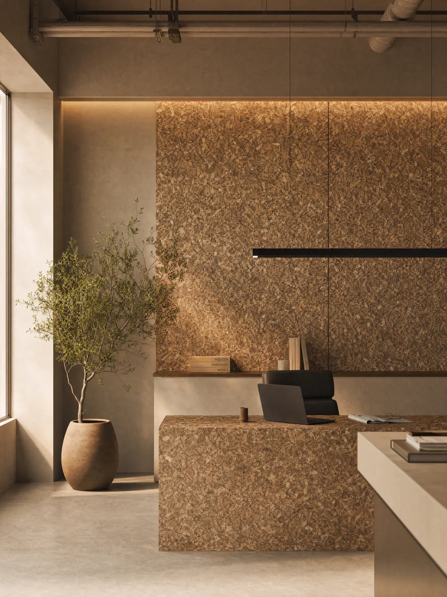 PHEE material sample tile on concrete surrounded by dried seagrass, husks and seeds