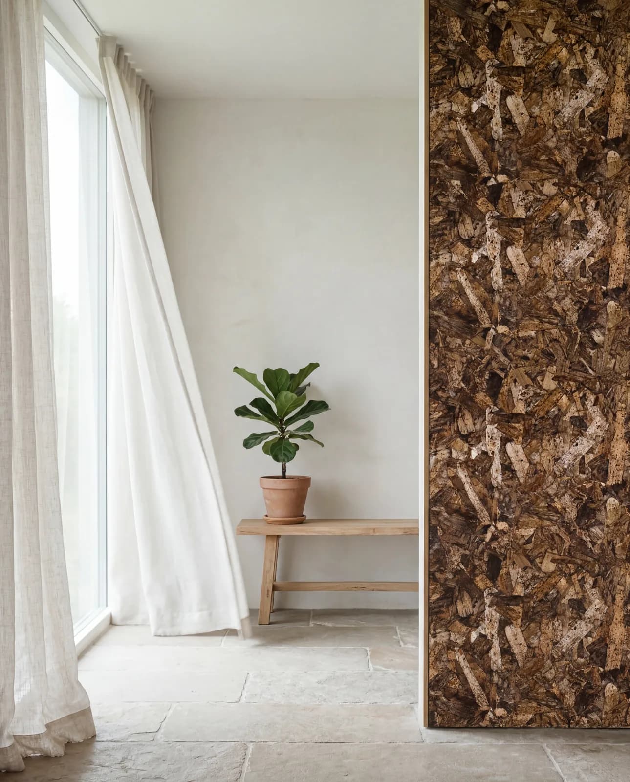 Airy, daylit room with a PHEE bio-composite panel wall, sheer linen curtain and a clean, breathable atmosphere